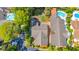 Aerial view of the property showcasing the roof, backyard, pool, patio, and surrounding trees at 8 Martinique Dr., Myrtle Beach, SC 29572