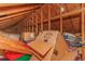 Attic featuring exposed wood beams, storage boxes, and available space for belongings at 8 Martinique Dr., Myrtle Beach, SC 29572