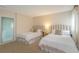Bright bedroom has two beds, soft textures and neutral color palette at 8 Martinique Dr., Myrtle Beach, SC 29572