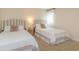 Well-lit bedroom features two twin beds, a neutral color palette, and a soft, inviting atmosphere at 8 Martinique Dr., Myrtle Beach, SC 29572