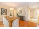 Dining room showcasing hardwood floors, unique light fixture, and tastefully decorated walls at 8 Martinique Dr., Myrtle Beach, SC 29572