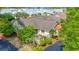 Aerial view of the home with lush landscaping, a well-maintained roof, and charming curb appeal at 8 Martinique Dr., Myrtle Beach, SC 29572