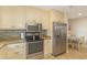 Well-appointed kitchen with stainless steel appliances, granite countertops, and mosaic tile backsplash at 8 Martinique Dr., Myrtle Beach, SC 29572