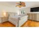 Comfortable main bedroom offers hardwood floors, a ceiling fan, and abundant natural light at 8 Martinique Dr., Myrtle Beach, SC 29572
