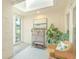 Bright sunroom with skylight, tile flooring, and lush greenery creating a relaxing atmosphere at 8 Martinique Dr., Myrtle Beach, SC 29572