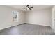 Bright bedroom with hardwood floors, ceiling fan, and natural light at 822 Highway 90, Conway, SC 29526