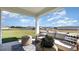 Covered porch featuring comfortable seating with a beautiful lawn view at 850 Farmers Passage Loop, Loris, SC 29569