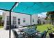 Inviting backyard featuring a pergola, an outdoor dining set, and green lawn at 867 Cardinal Pl., North Myrtle Beach, SC 29582