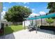 Paver patio with a pergola offering a cozy outdoor dining space and a view of the well-manicured lawn at 867 Cardinal Pl., North Myrtle Beach, SC 29582