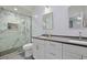 Modern bathroom featuring dual sinks, granite countertops, and a glass enclosed marble shower at 867 Cardinal Pl., North Myrtle Beach, SC 29582