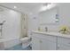 Well-lit bathroom with a shower-tub combo, modern vanity with storage, and a sleek, framed mirror at 867 Cardinal Pl., North Myrtle Beach, SC 29582