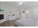 This bedroom features hardwood floors, a ceiling fan, and a fireplace at 867 Cardinal Pl., North Myrtle Beach, SC 29582