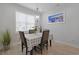 Cozy dining room with a chandelier, a checkered tablecloth, and a painting of a scenic view at 867 Cardinal Pl., North Myrtle Beach, SC 29582