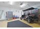 Spacious garage with epoxy flooring, ample storage, and a golf cart, perfect for beach living at 867 Cardinal Pl., North Myrtle Beach, SC 29582