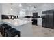 Modern kitchen with white cabinets, stainless steel appliances, a breakfast bar, and stylish countertops at 867 Cardinal Pl., North Myrtle Beach, SC 29582