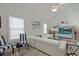 Bright living room with a vaulted ceiling, stylish furniture, light-colored walls, and plenty of natural light at 867 Cardinal Pl., North Myrtle Beach, SC 29582