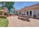 Backyard patio featuring an outdoor fireplace, comfortable seating, and an outdoor kitchen at 901 Southwind Ct., Garden City Beach, SC 29576
