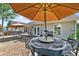 Backyard patio with multiple seating areas and a built in grill for outdoor entertainment at 901 Southwind Ct., Garden City Beach, SC 29576