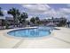 Large community pool with ample lounge seating, perfect for relaxing and enjoying the outdoors at 901 Southwind Ct., Garden City Beach, SC 29576