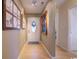 Well-lit hallway with hardwood floors, decorative trim, and art providing an elegant and welcoming entrance at 901 Southwind Ct., Garden City Beach, SC 29576