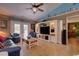 Cozy living room featuring a built in entertainment center, light hardwood floors, and a beamed ceiling at 901 Southwind Ct., Garden City Beach, SC 29576
