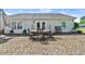 Charming outdoor patio with dining table, perfect for enjoying outdoor meals and gatherings at 901 Southwind Ct., Garden City Beach, SC 29576