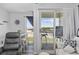 Balcony view of the ocean and beach from a condo with stools and an outdoor table at 9400 Shore Dr. # 509, Myrtle Beach, SC 29572