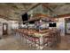 Full bar with mirrored backdrop and multiple televisions at 9400 Shore Dr. # 509, Myrtle Beach, SC 29572