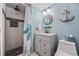 Coastal bathroom design with tiled walk-in shower and nautical decorative anchor at 9400 Shore Dr. # 509, Myrtle Beach, SC 29572