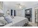Bedroom featuring washer/dryer unit in closet, complemented by seaside decor, and natural light at 9400 Shore Dr. # 509, Myrtle Beach, SC 29572