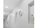 Bright hallway featuring a clock, decorative niche, and minimalist design, showcasing modern interior details at 9400 Shore Dr. # 509, Myrtle Beach, SC 29572