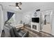 Cozy living room features wood floors, a ceiling fan, and an electric fireplace, and decorative anchor at 9400 Shore Dr. # 509, Myrtle Beach, SC 29572
