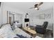 Comfortable living room with sleeper sofa, chair, tv and open access to an adjacent bedroom at 9400 Shore Dr. # 509, Myrtle Beach, SC 29572