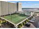 Aerial view of tennis courts next to parking at the Sands Beach Club at 9400 Shore Dr. # 509, Myrtle Beach, SC 29572