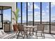 Patio seating with ocean view through expansive windows at 9400 Shore Dr. # 509, Myrtle Beach, SC 29572