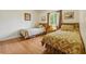 Bedroom with hardwood floors, two twin beds, and a large window at 951 Plantation Dr. # F8, Little River, SC 29566