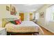 Bedroom with wood floors, bright lighting, and natural light from the window at 951 Plantation Dr. # F8, Little River, SC 29566