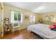 Bright bedroom with hardwood floors and windows offering ample natural light at 951 Plantation Dr. # F8, Little River, SC 29566