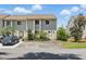 Charming townhome with well-maintained landscaping and a private driveway at 951 Plantation Dr. # F8, Little River, SC 29566