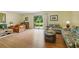 Comfortable living room with wood-look floors and sliding glass doors to the backyard at 951 Plantation Dr. # F8, Little River, SC 29566