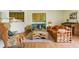 Open-concept living room with wood-look flooring, and view to the kitchen at 951 Plantation Dr. # F8, Little River, SC 29566