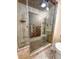 Modern tiled shower with glass doors, rainfall shower head, and custom tile work at 9840 Queensway Blvd. # 329, Myrtle Beach, SC 29572