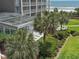 Building with an outdoor pool, and lounge seating at 9840 Queensway Blvd. # 329, Myrtle Beach, SC 29572