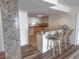 Kitchen with granite countertops, a breakfast bar, and white cabinets at 9840 Queensway Blvd. # 329, Myrtle Beach, SC 29572