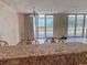 A bright living space with expansive windows and a view of the water at 9840 Queensway Blvd. # 329, Myrtle Beach, SC 29572