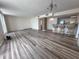 A spacious living area featuring hardwood floors, a breakfast bar and plenty of natural light at 9840 Queensway Blvd. # 329, Myrtle Beach, SC 29572