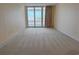 Bright living room has a large sliding glass door leading to the outside at 9840 Queensway Blvd. # 329, Myrtle Beach, SC 29572