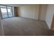 Bright living room has a large sliding glass door leading to the outside at 9840 Queensway Blvd. # 329, Myrtle Beach, SC 29572