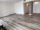 Bright living room features beautiful hardwood floors and a decorative column at 9840 Queensway Blvd. # 329, Myrtle Beach, SC 29572