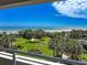Gorgeous view from the balcony, overlooking manicured lawns, tall trees and a sandy beach at 9840 Queensway Blvd. # 329, Myrtle Beach, SC 29572